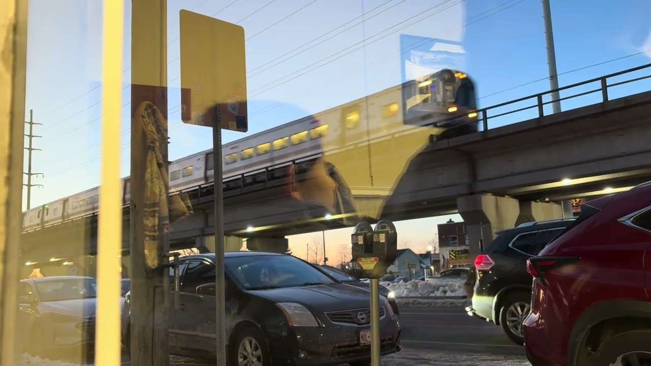 3 LIRR trains passing by.