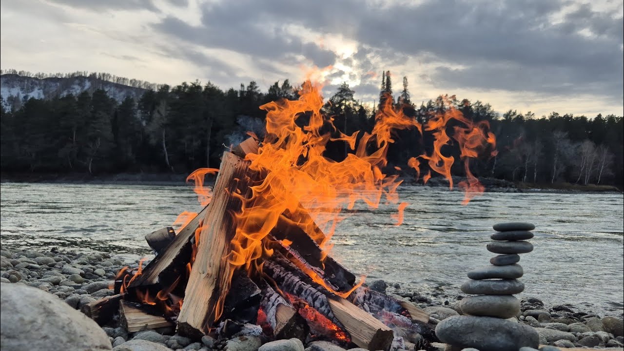 Bonfire. River. Mountains