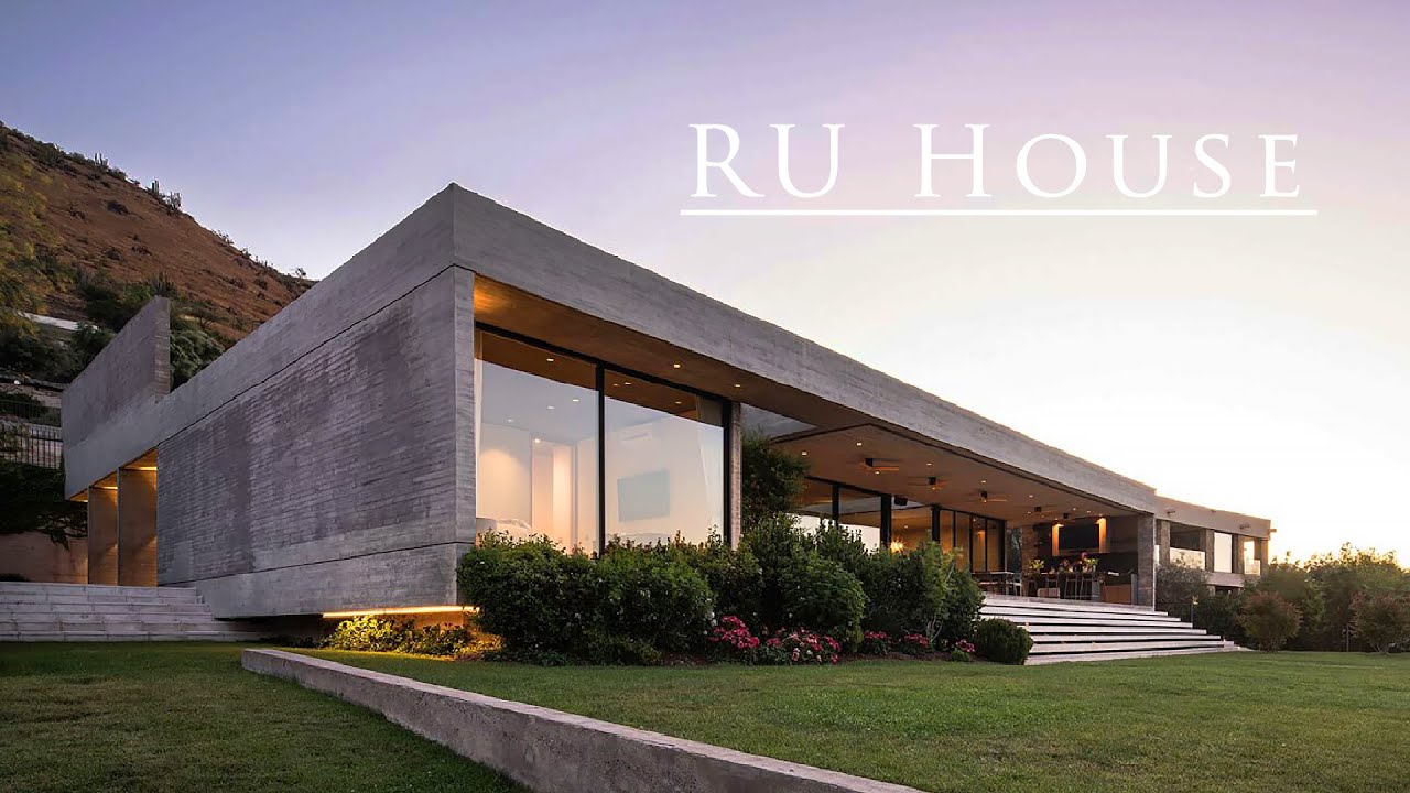 Modern house on a relief with courtyard and rooftop garage