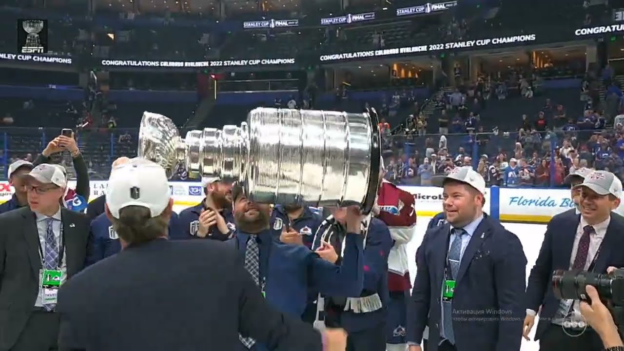 Joe Sakic #19 hold the up Stanley Cup again after 21 years