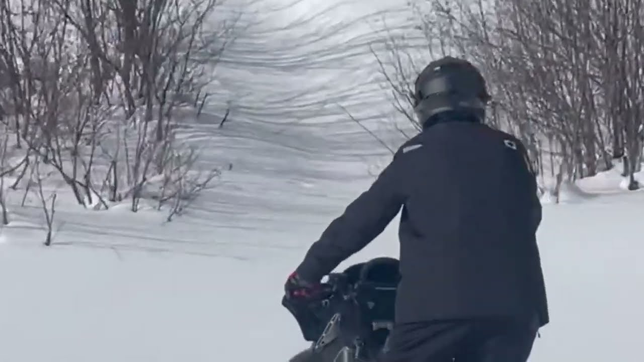 Snowmobiling near Hudson Bay, Saskatchewan.