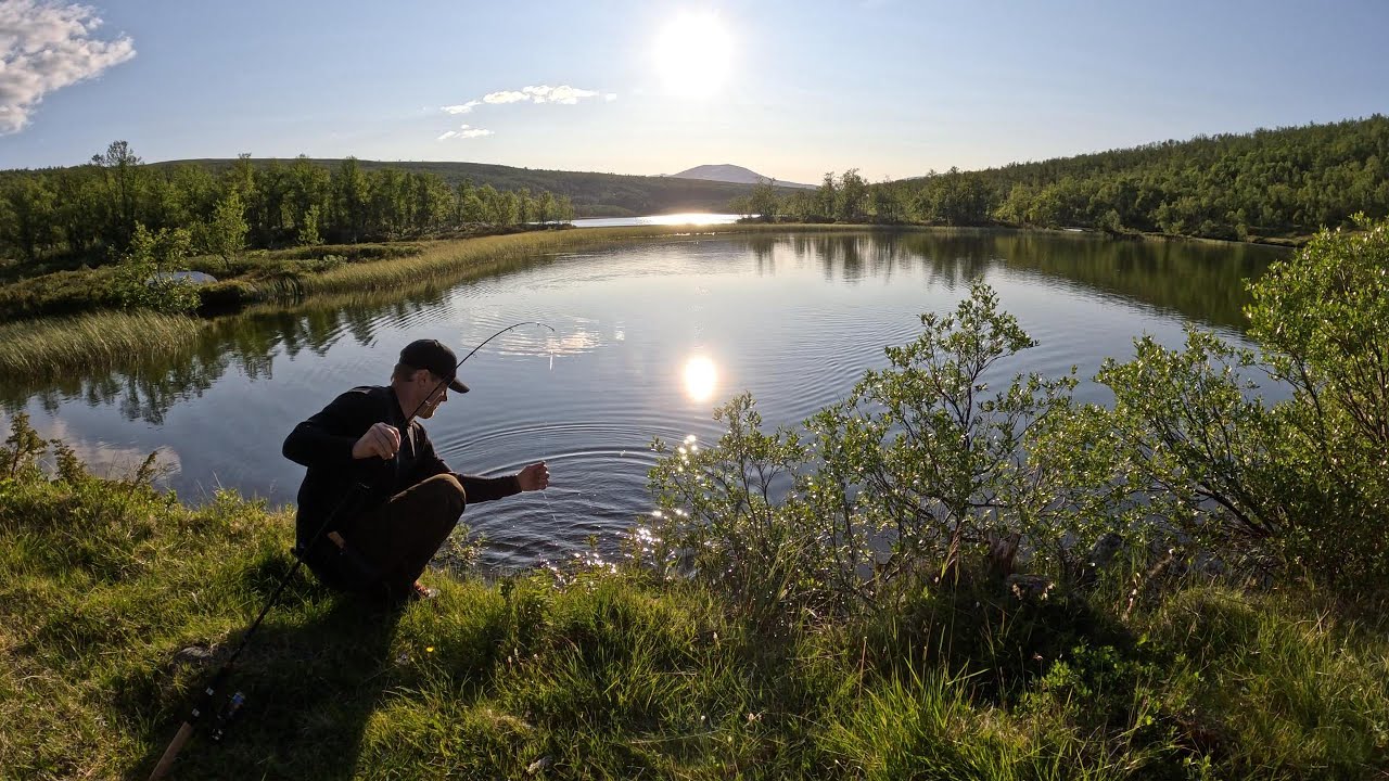 Catching trout in a crystal clear lake