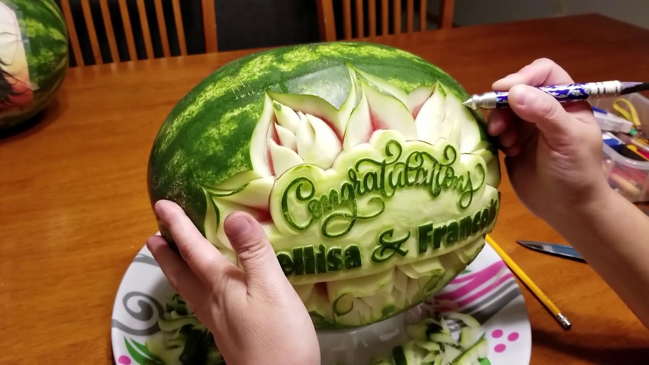 Watermelon carving with names and simple flower design