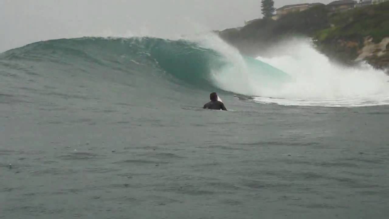 Surfing Dee Why point from the water