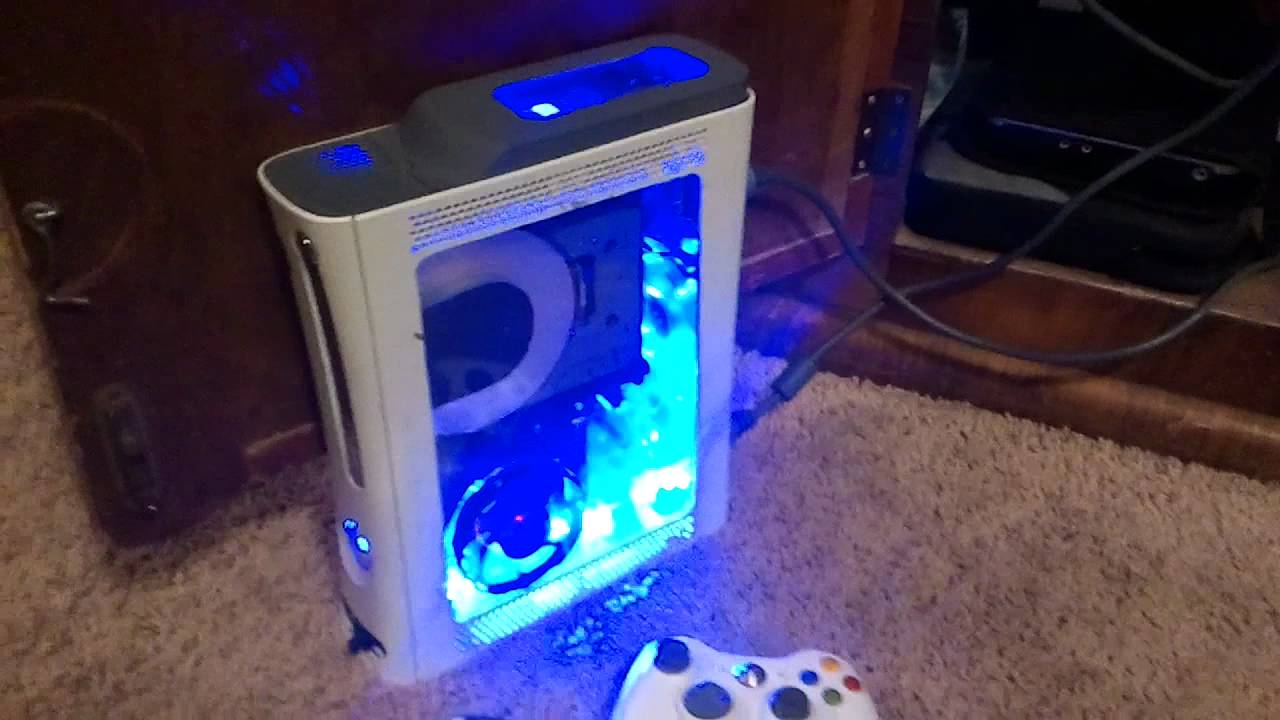 Two Custom Xbox 360's ( plexiglass window, hard drive mod, cut dvd drive, lots of led's, console))