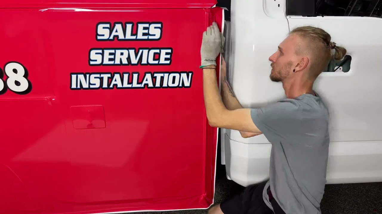 A Billboard With Doors On Wheels | Utility Bed Wrap