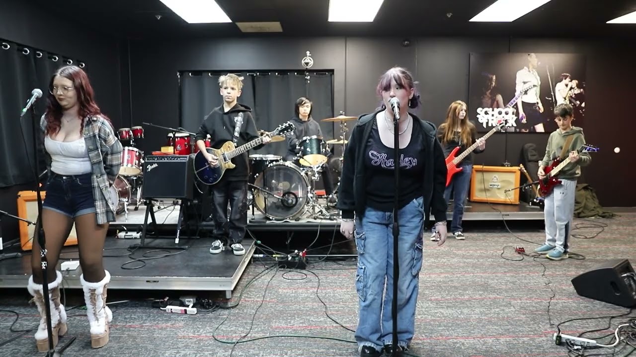 Eden Prairie School of Rock House Band singing Breaking the Law 1