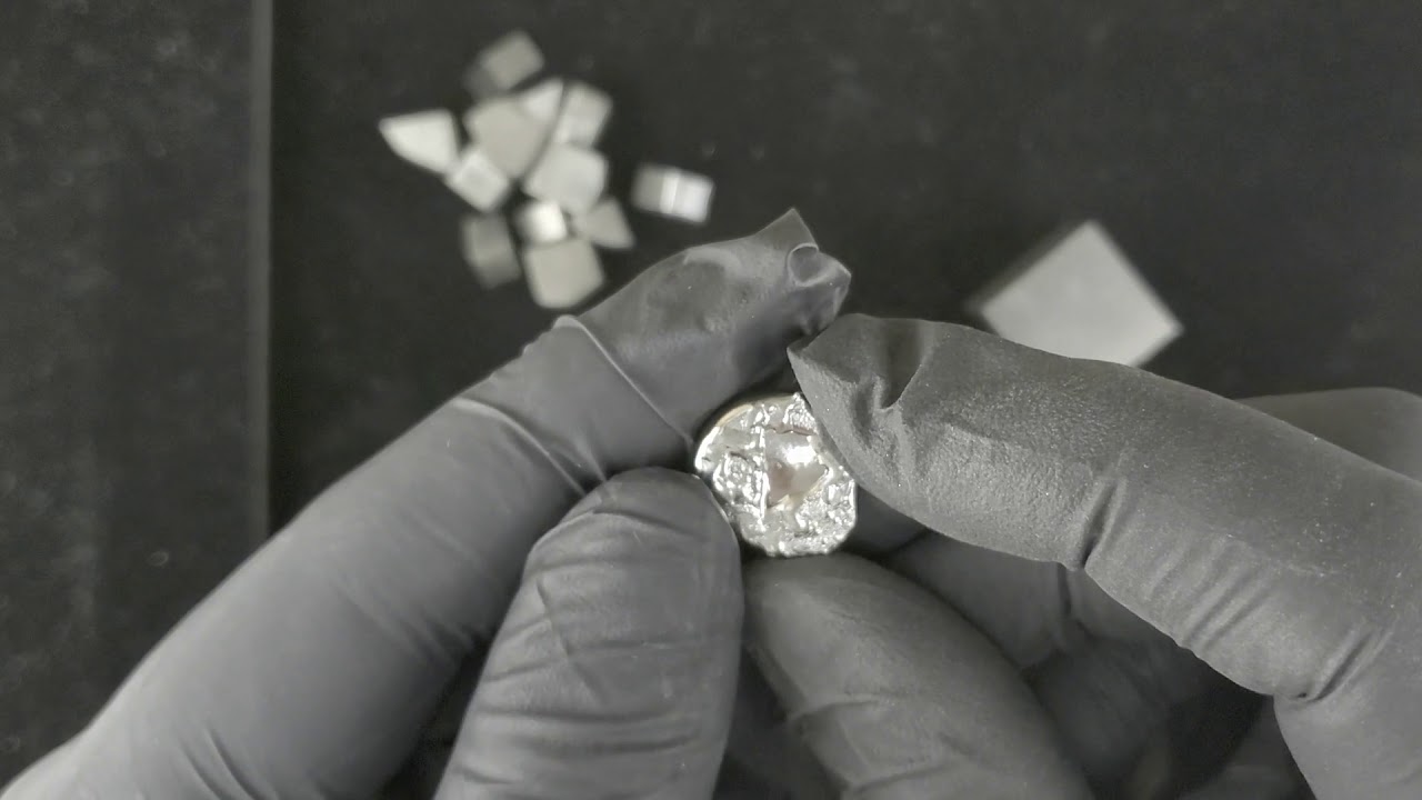 What does hafnium metal look like?