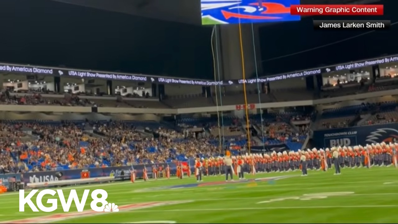 US airman who died after rappel fall at college football game identified