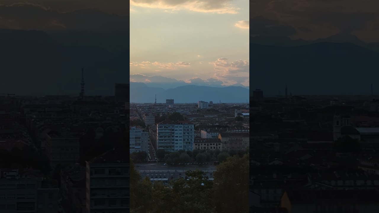 Sunset over Turin &mdash; the city glowing in golden light with the mountains beyond 🌇🏔️🇮🇹#travel #italy