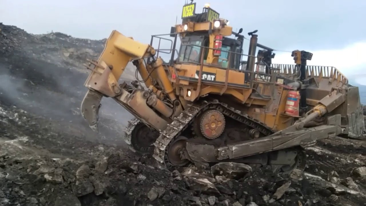 Caterpillar D10 ripping rock