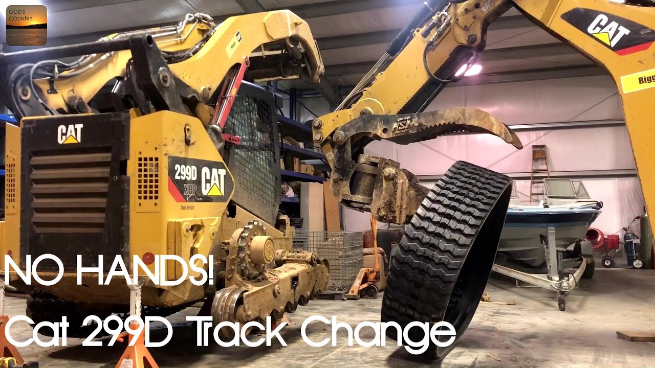 Cat 299D Track Change with a Cat 420F and PSM Tilt Coupler