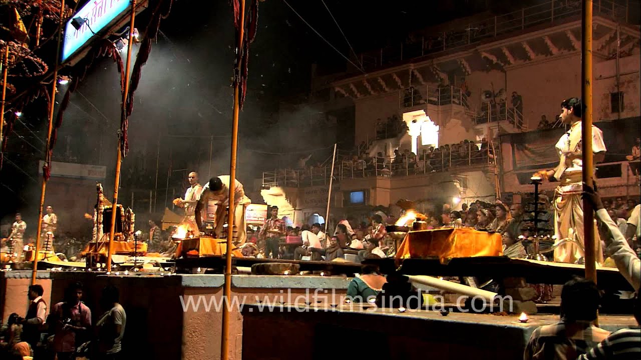Priests performing evening Ganga aarti on the banks of Varanasi