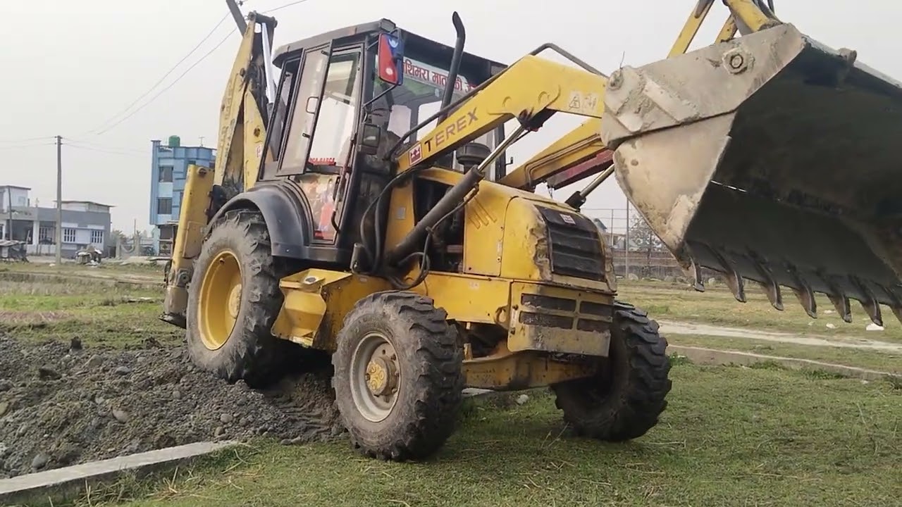 Backhoe loader digging the foundation of a house built from I-beams.#terex #jcb #cat #construction