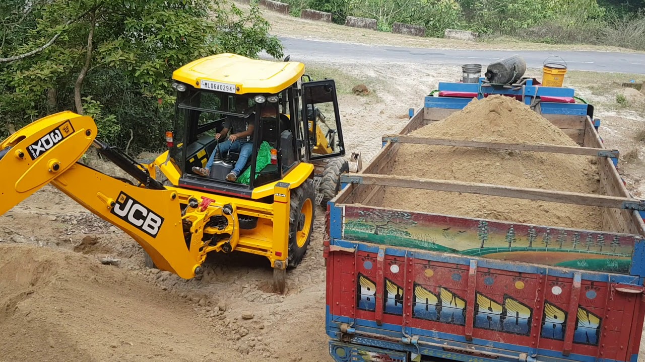 Jcb loading sand in a truck##jcb loading