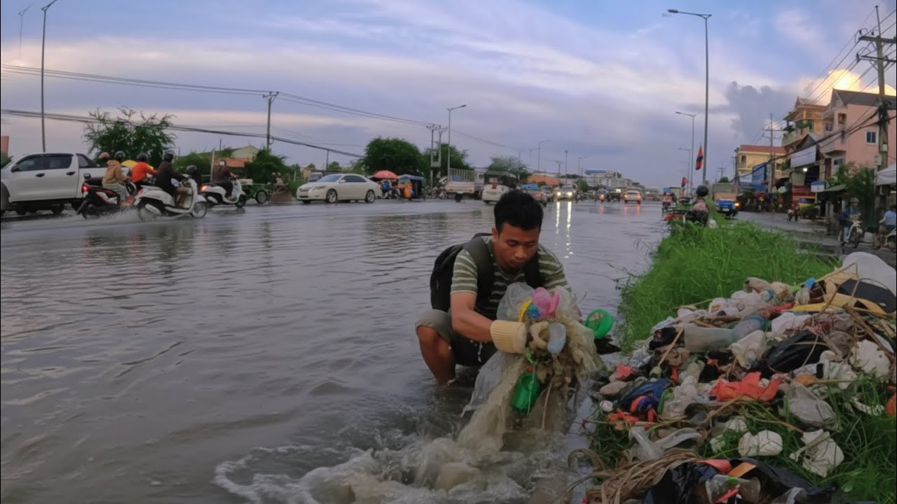 Plastic Cleanup Amid the Flood A Street's Recovery Process and Unclog Drain