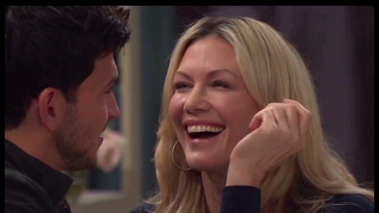 Alex and Kristen kiss in the square