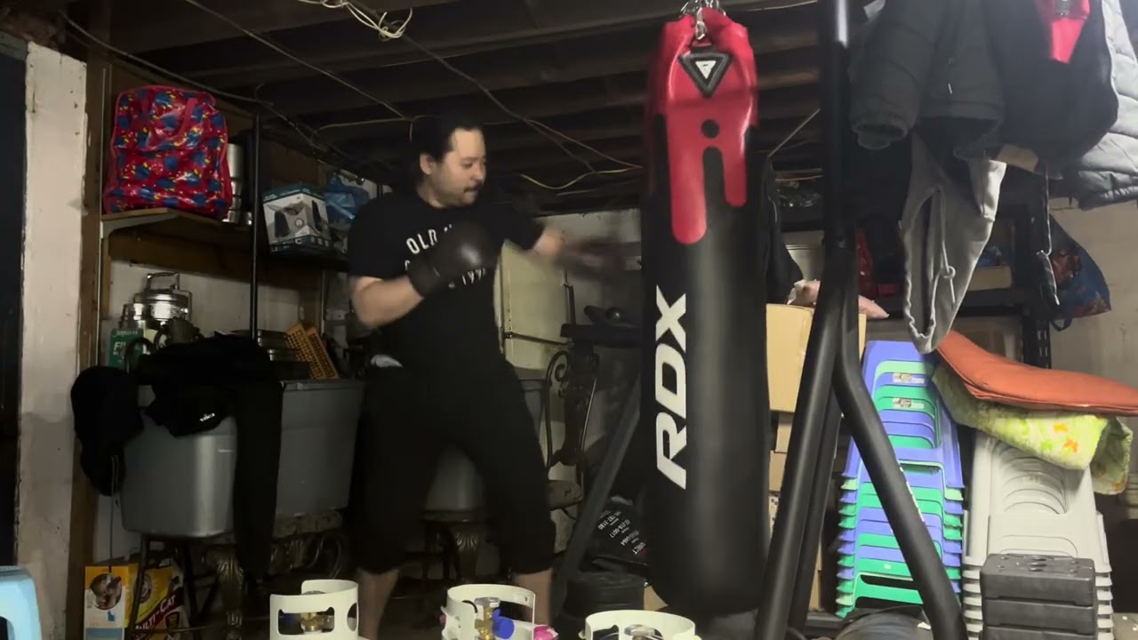 6oz everlast bag gloves on 119lb rdx punching bag on Christmas throwing as many 1-1-2s as I can 
