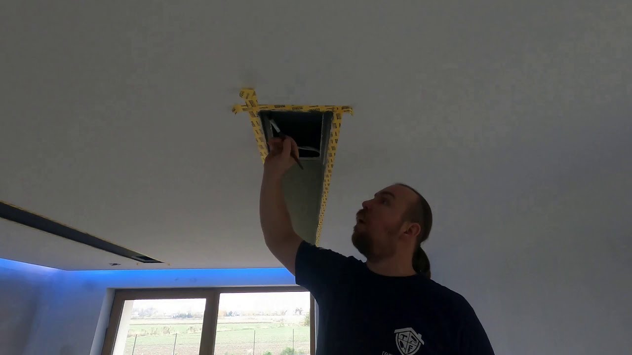 Painting black recess on the white ceiling (timelapse)