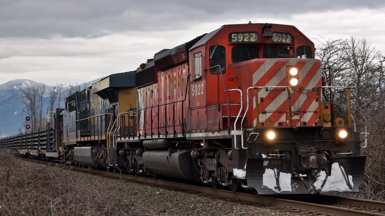 CP Pacman SD40-2 Paired with CSX Foreign Power Leads Continuous Welded Rail Train on the CN Yale Sub