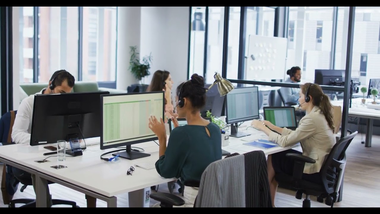 Diverse Business Colleagues Working Together at Desks - Amazing!