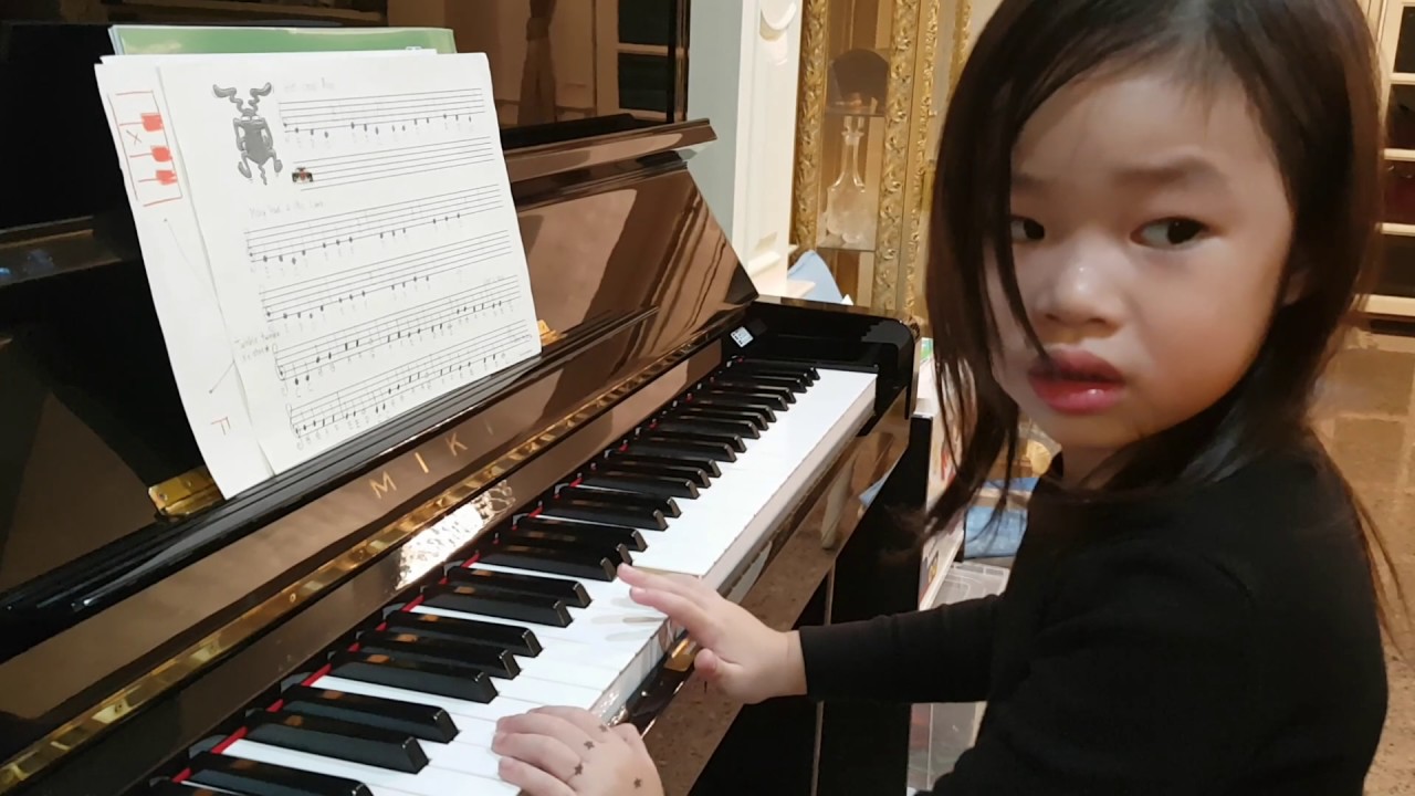 Titan 44 months play piano
