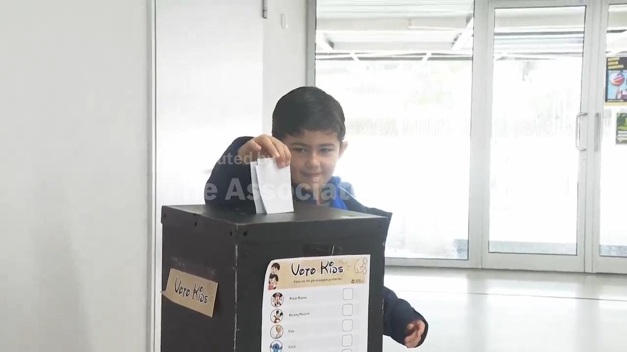 Children vote for their favourite cartoon characters as Portuguese voters pick a new president