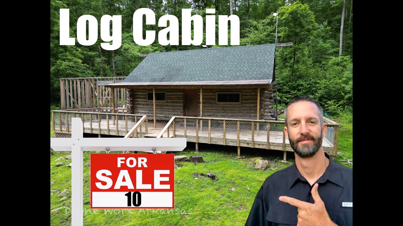 Log cabin for sale in the Ozark Mountains of Arkansas. 10 acres with a creek  in the yard.