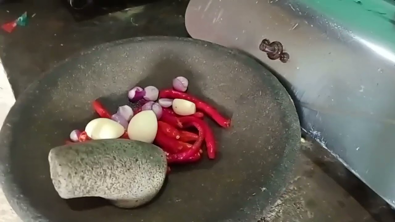 Cook purple eggplant mixed with rambak crackers or krecek, village style