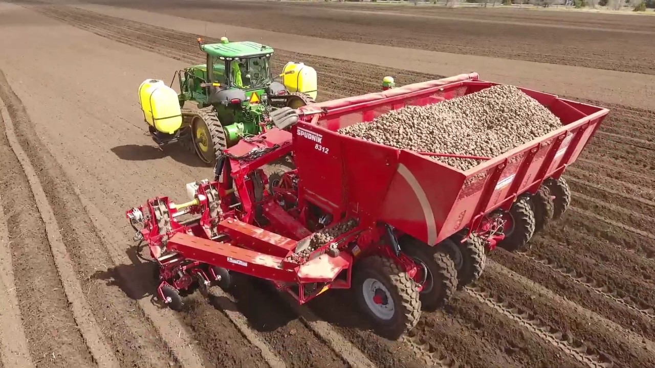 Worlds largest potato planter, SPUDNIK 8312 Twelve Row folding Potato Planter