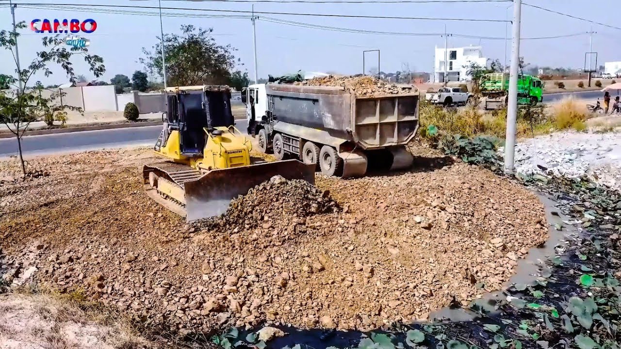 Fantastic! Landfilling Start Project By Team  Dozer KOMATSU DR51PX with Dump Trucks pouring soilRock