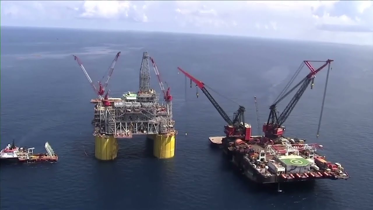 Shell scales back 2030 carbon emissions target | REUTERS