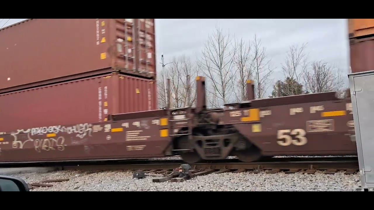NS 279 heads west crossing shell road