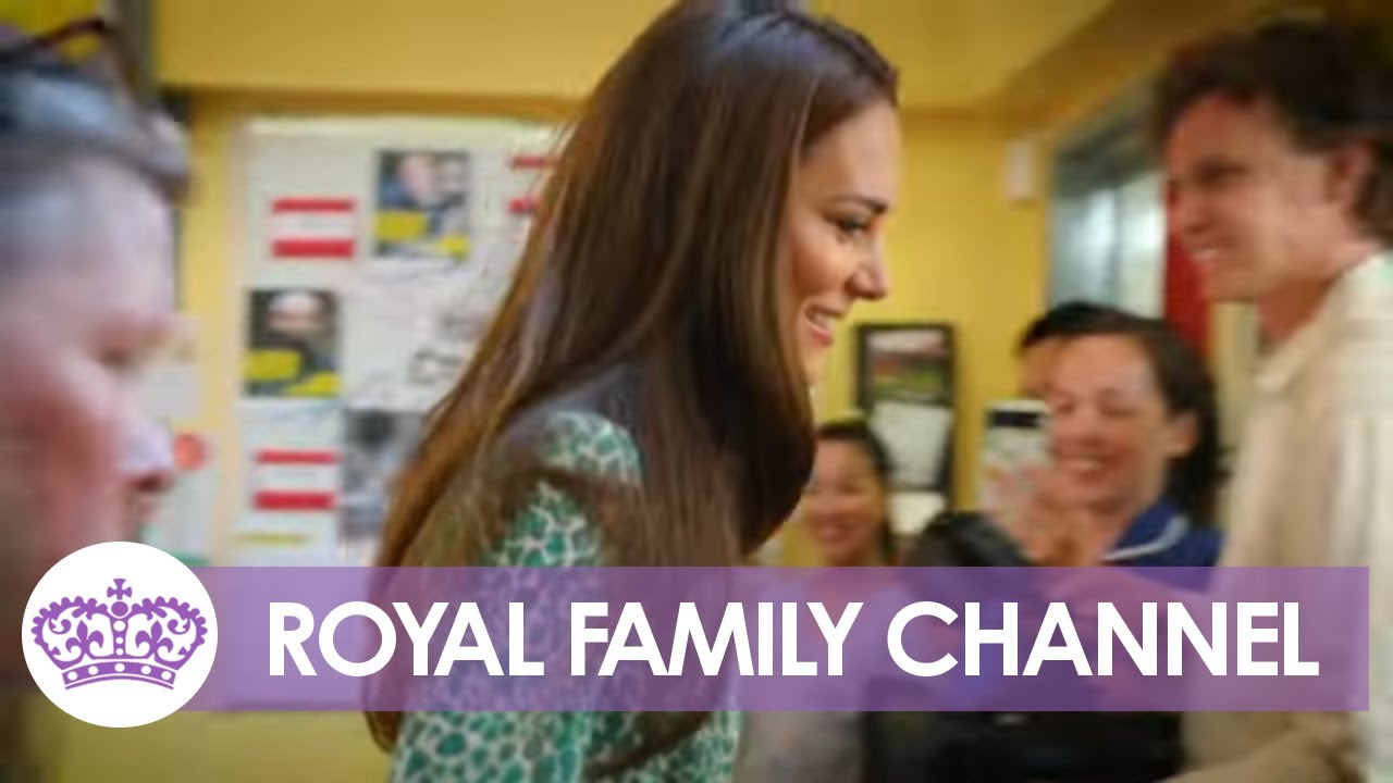 Kate Bonds with Boy Over Football on Children's Centre Visit