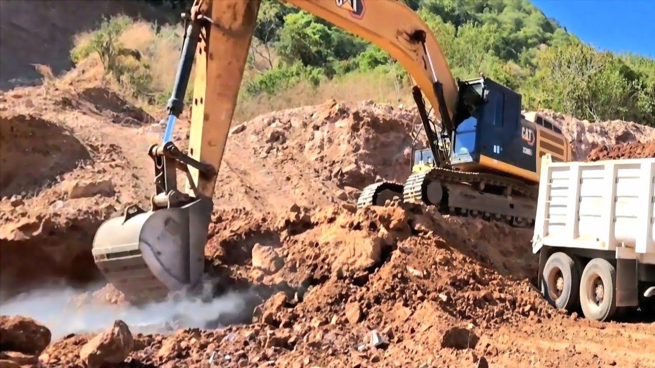 CAT 336EL Excavator Loads Dump Trucks with Fill Material