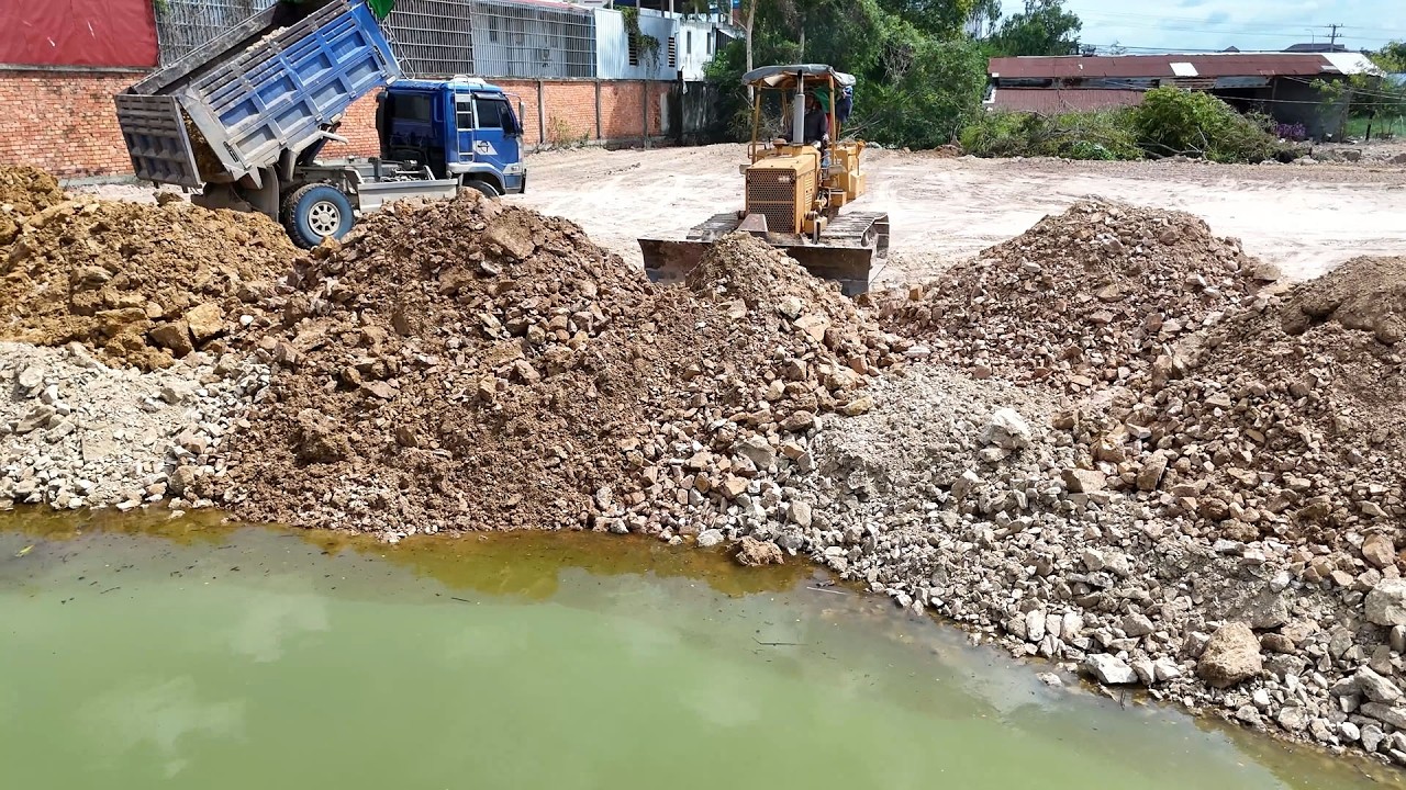 Skilled Operation Begins!! Using KOMATSU D31p Dozer And 6-Wheel Dump Trucks Filling Flooded Land.