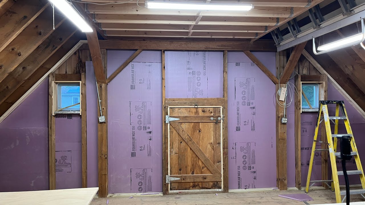 Insulating an exterior wall for a post and beam barn