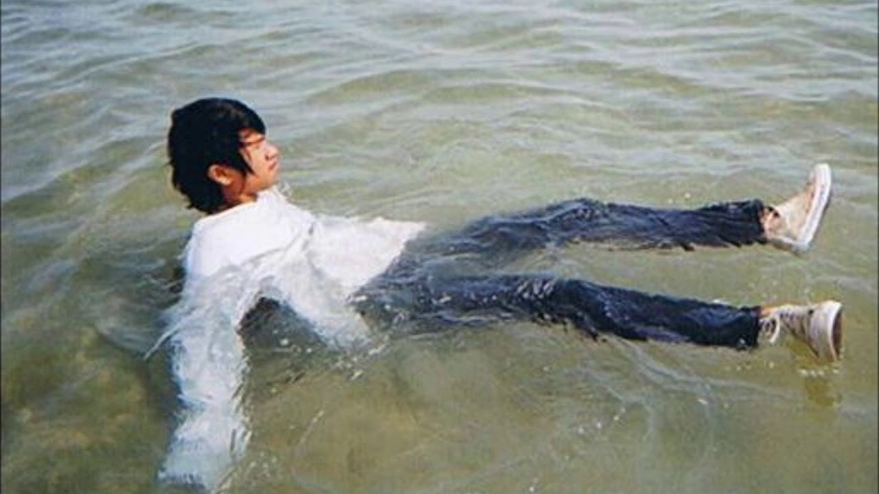 Thai boys like to swim with all their clothes on