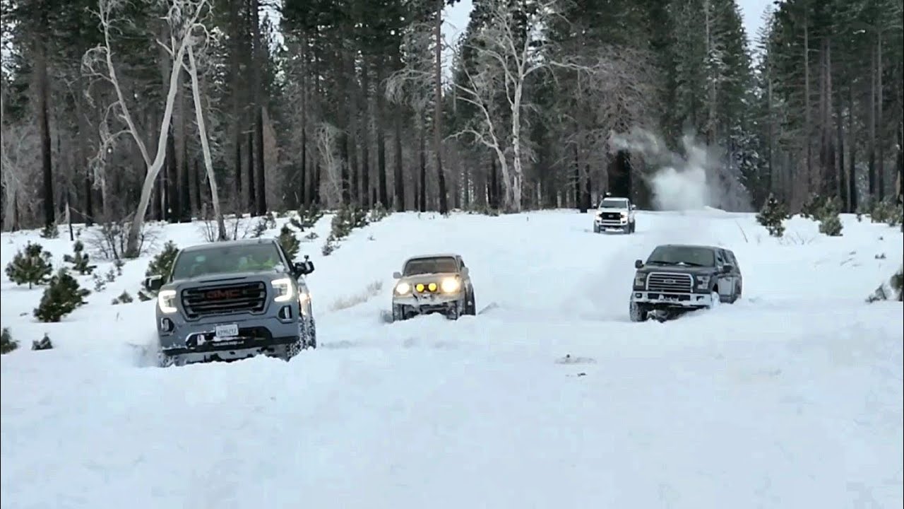 GMC Sierra AT4 6 inch lift 35s vs Land Cruiser 35s vs Jeep Rubicon 35s vs F150 37s Snow Wheeling 