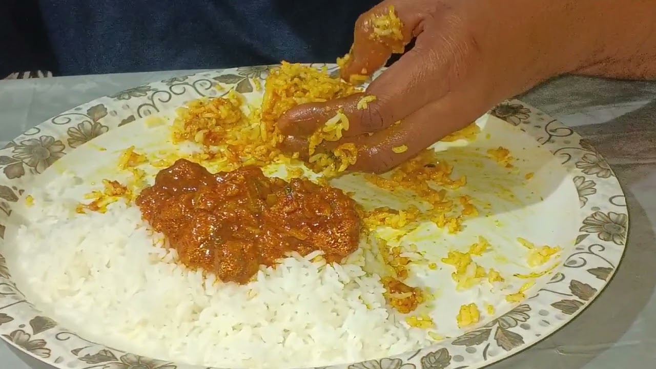 Eating rice and spice mutton Korma curry 