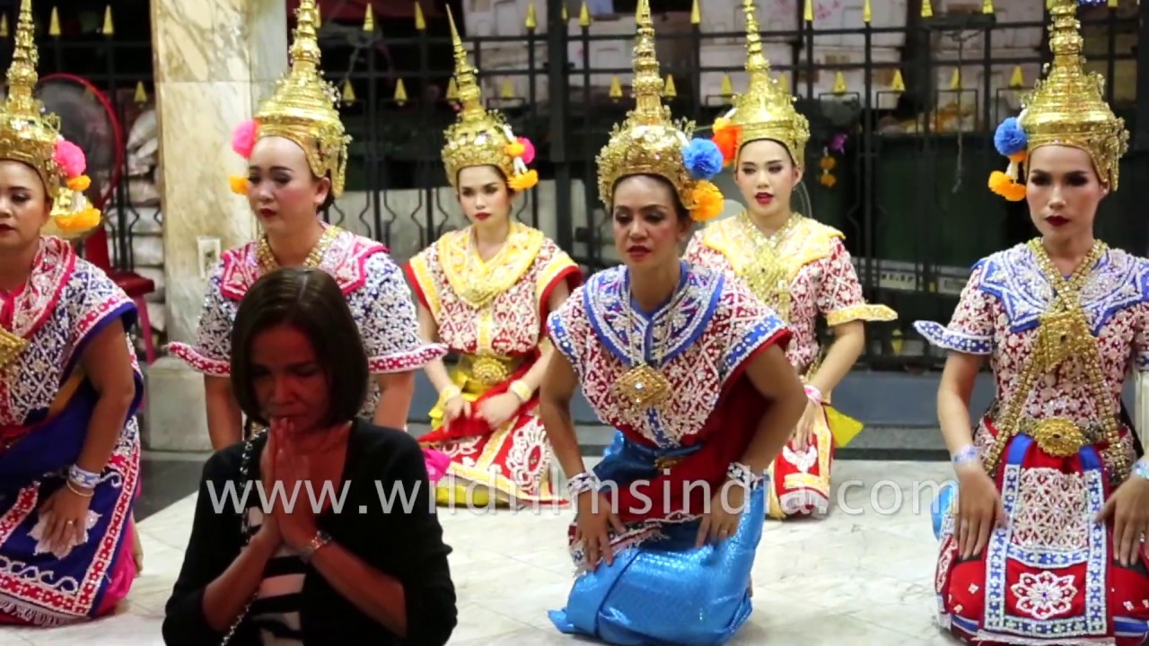 Thai women visit Brahma temple to pray, dancers perform at Erawan shrine in Bangkok