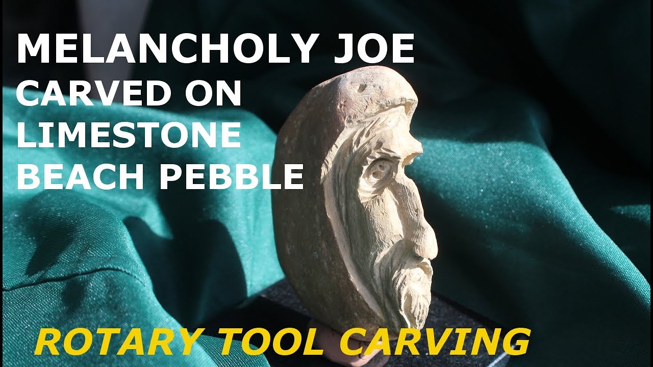 Stone carving a Limestone man. Pick up a pebble and carve it!