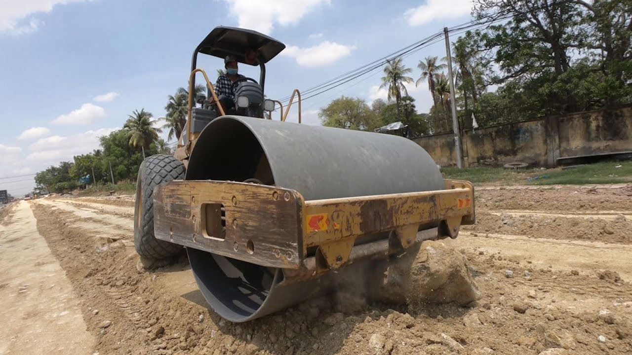 Road construction heavy equipment part 2 SDLG grader & Cat Vibratory Rollers in action
