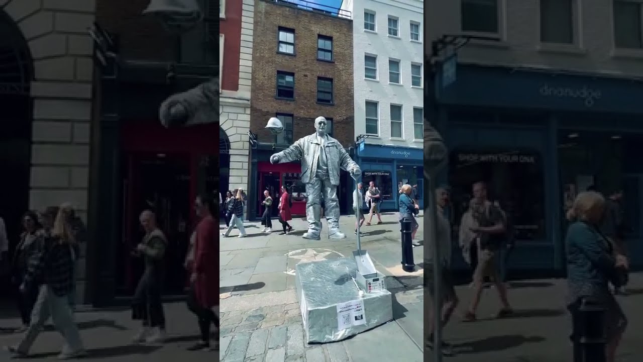 How Silver man statue is levitating his hat ? 😳