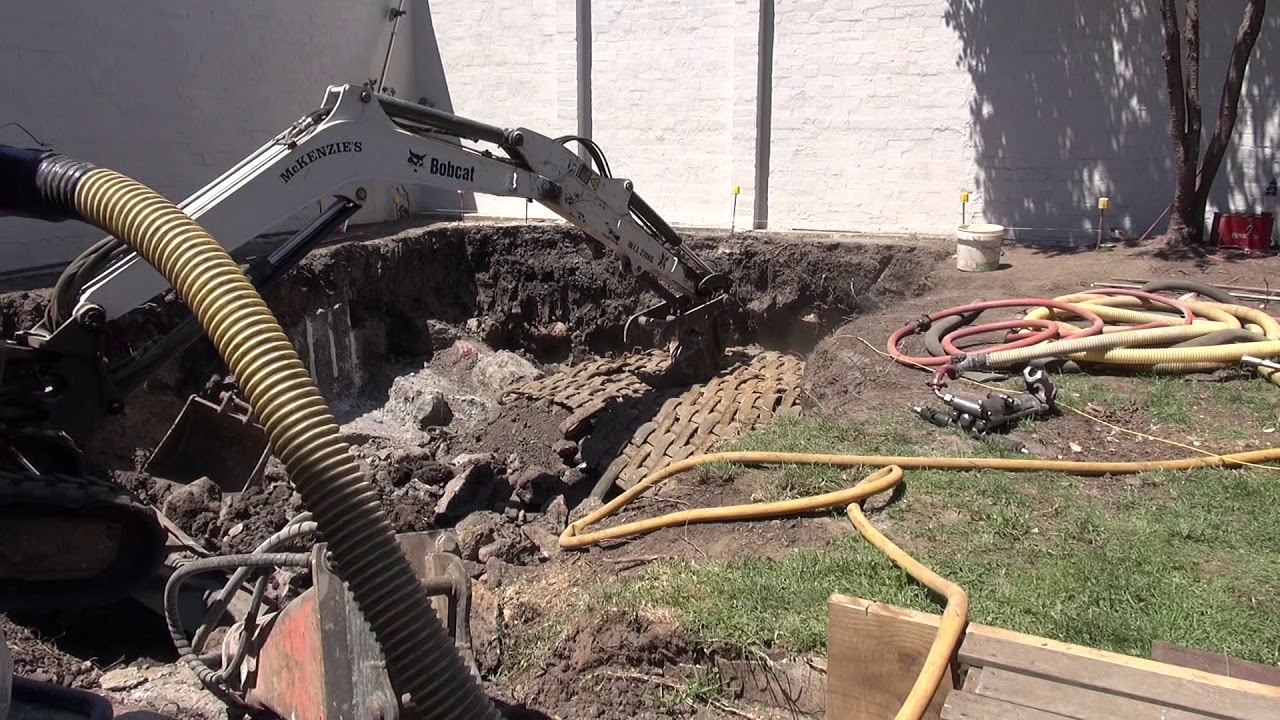 Delicate rock blasting for a back yard swimming pool