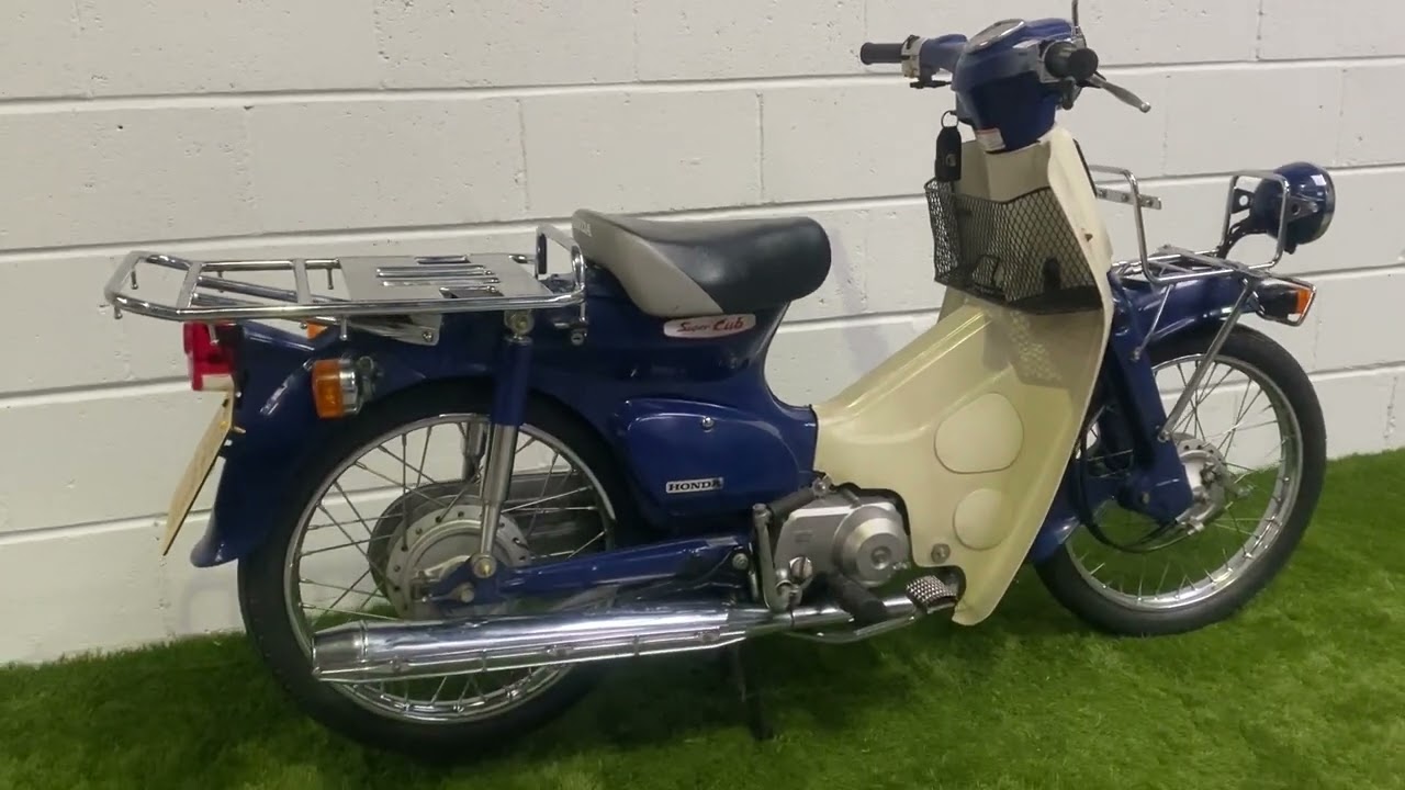 Honda C50 Press Cub 2005 года выпуска. Зарегистрирована в Великобритании. Номер модели 1959.