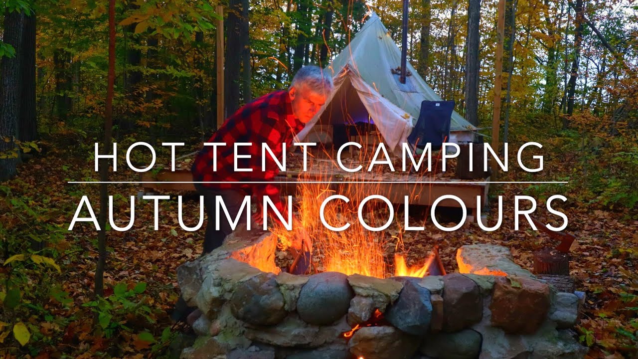 Autumn camping, warm sunny fall day, the leaves are turning, hot tent in the woods