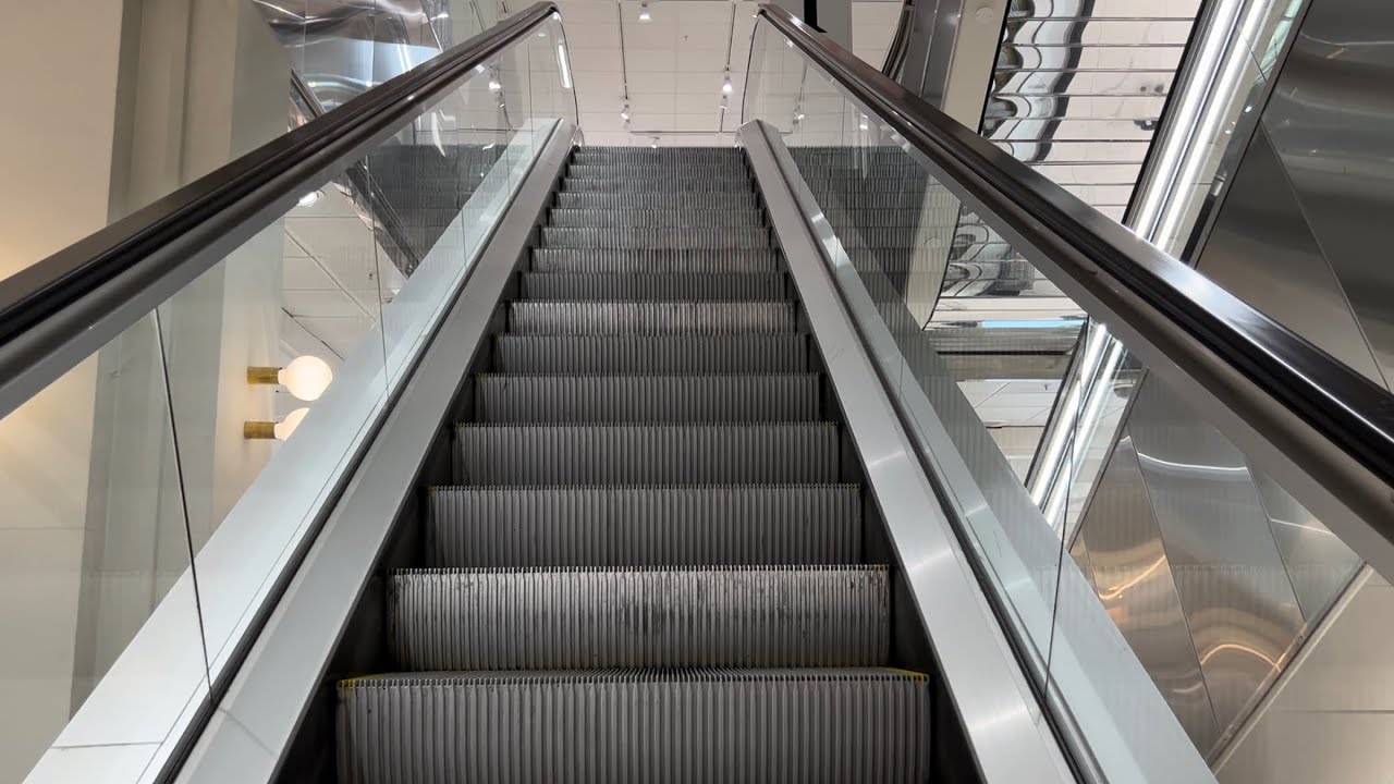Stockholm, Sweden. 3x Escalator ride up at Ahlens City Department Store