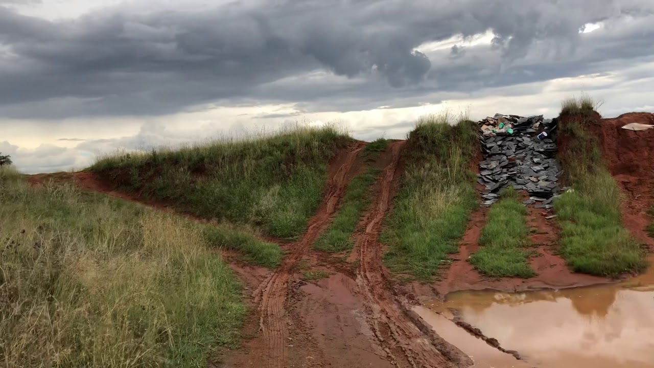 Koleos up muddy incline.