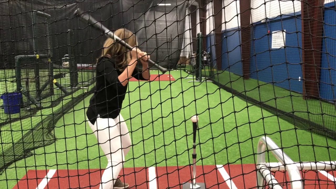 CAGE WORK! Kari Steele works on launch angle inside the Tennessee Smokies new batting facility